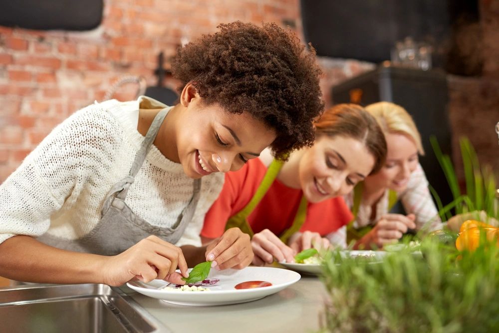 People preparing food together during a cooking class