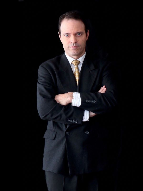 Man in suit with arms crossed 