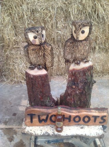 wood carving of 2 owls