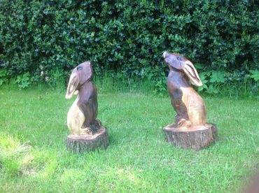 wood carving of 2 rabbits
