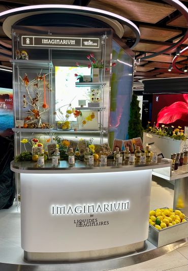 Imaginarium booth showcasing creative liquid displays.