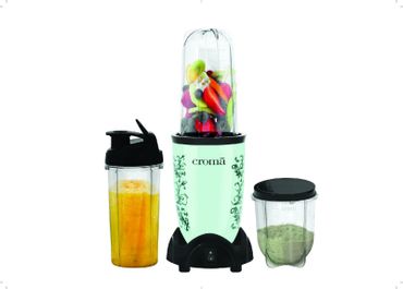 Croma blender with fruits, juice, and green smoothie containers.