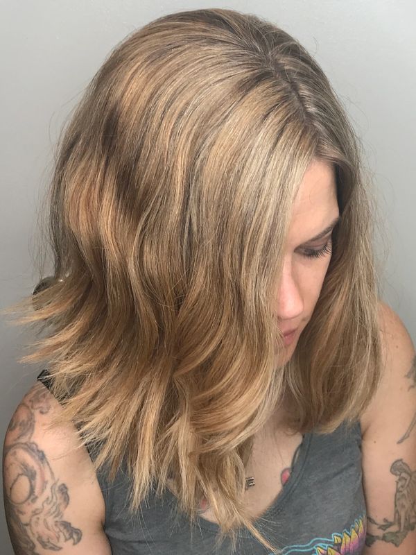 Blonde highlights on medium wavy hair