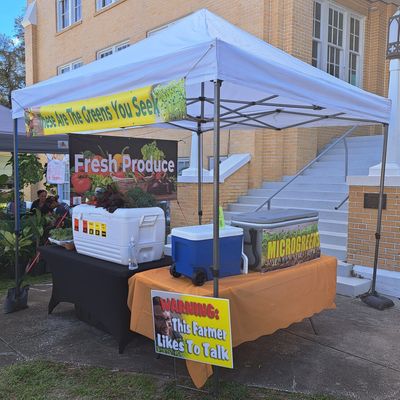 Market Tent tricked out with advertising.