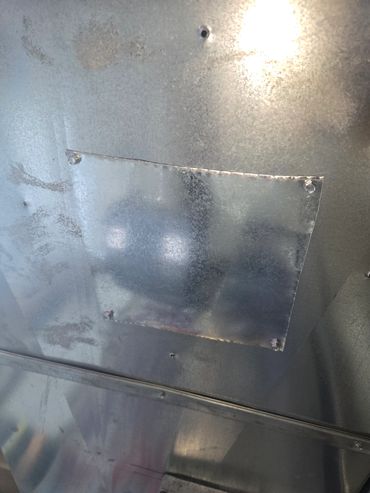 This is how we Patch up the big hole in your Ductwork. A piece of sheet metal and screws. 