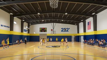 Youth basketball game in gym.