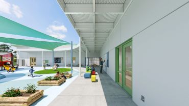 Modern outdoor school playground with shaded areas.