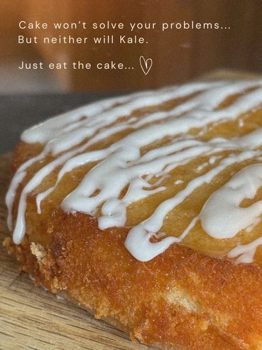 Close-up of a glazed cake with a humorous text about cake and kale.
