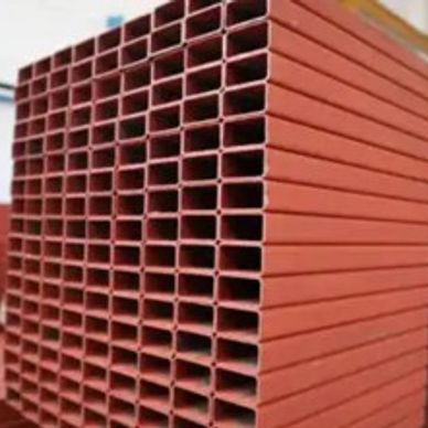 Stack of rectangular red steel pipes organized in a grid.