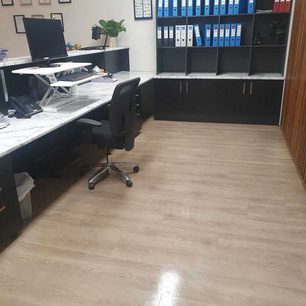Modern office workspace with desk and chair.