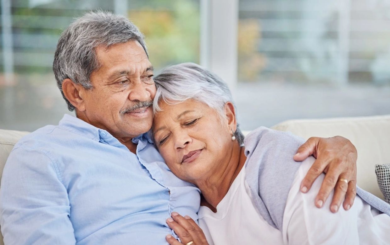 Older couple embracing, resting, reflecting love, connection and being present for the moments that 