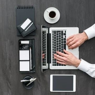 Person at a desk working on accounting
