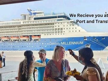 Guests welcomed at the port with a cruise ship in the background.