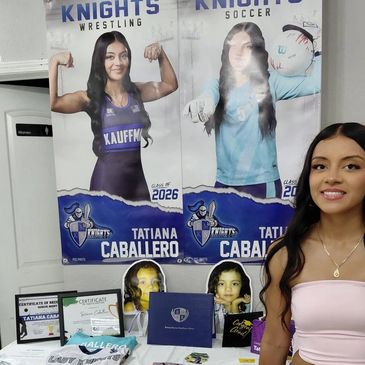 Young woman posing with sports posters and awards on display.