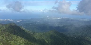 Mountainous landscape under a partly cloudy sky.