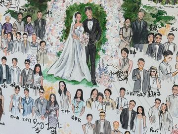 Hand-painted wedding guest portrait displayed on the floor.