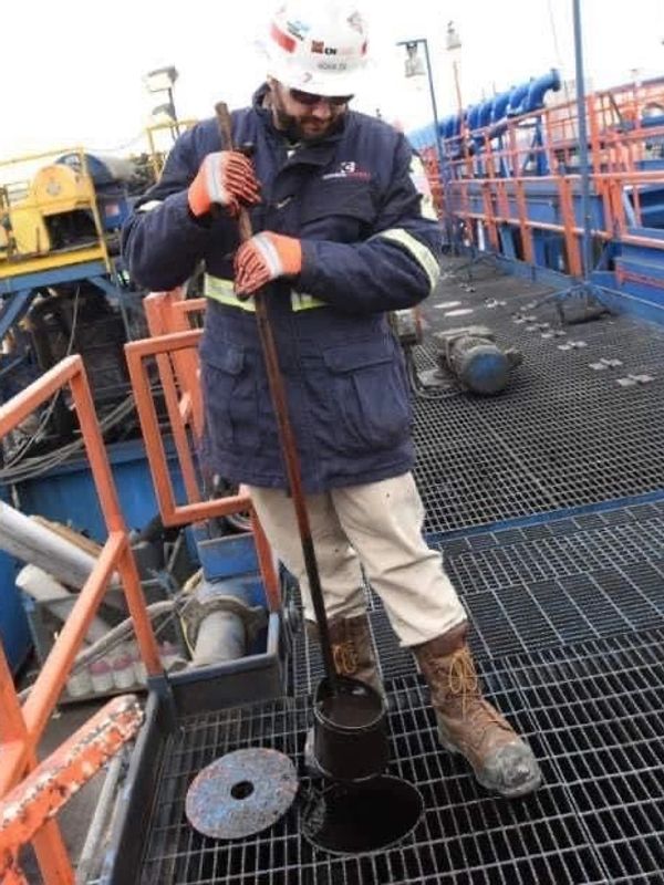 oilfield worker working on rig