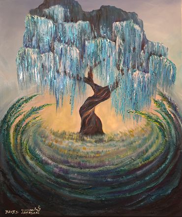 Weeping willow tree with long, tall grass rising and encircling in the forefront