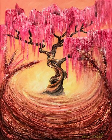 copper wheat grass swooping up on sides surrounding weeping cherry tree in bright sunset