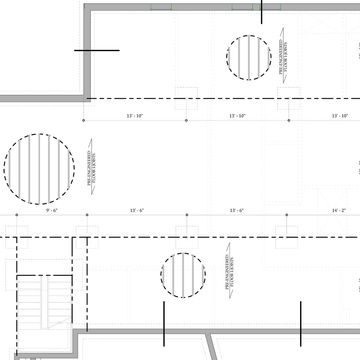 Architectural floor plan with circular features and dimensions.