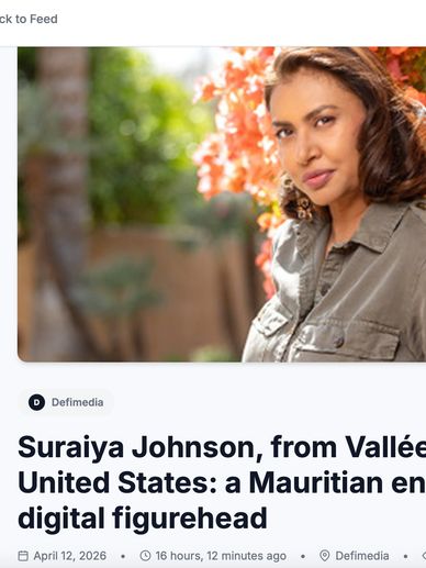 Portrait of Suraiya Johnson outdoors with vibrant flowers in the background.
