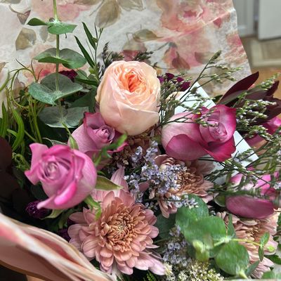 Hand-tied flower bouquet wrapped in paper