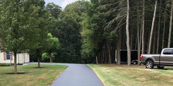 York Asphalt & Sealcoat sealcoating a driveway in spring grove