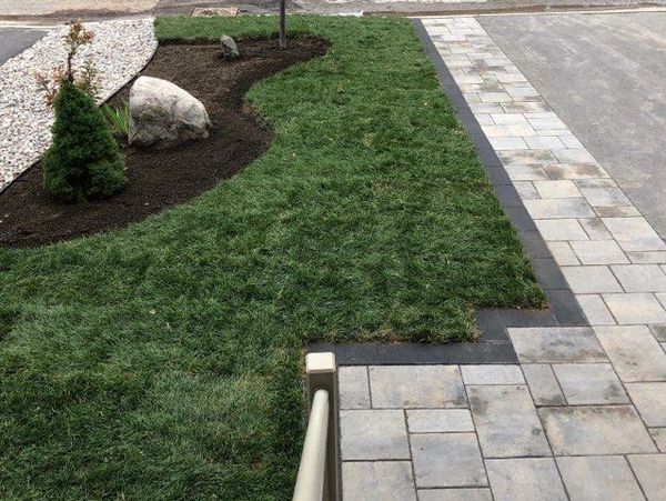 Uneven lawn and walkway alignment