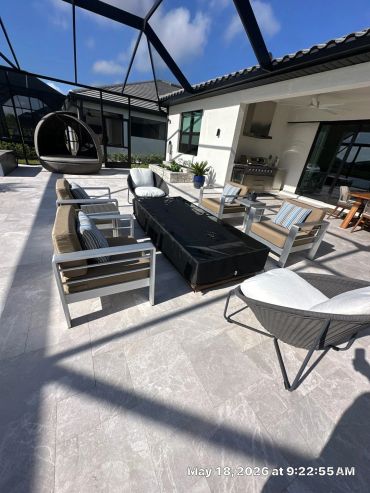 Modern outdoor patio with seating and canopy.