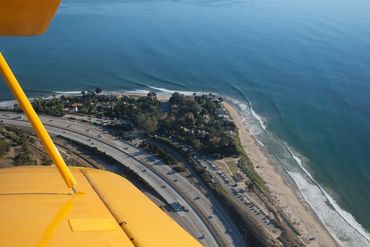 Dave Castro Photography view of coast from yellow plane