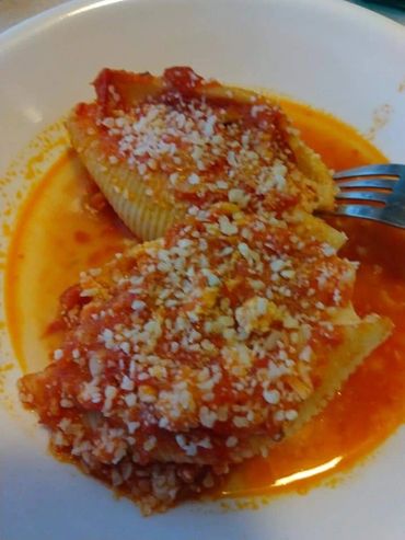 A pasta meal with pasta sauce and cheese