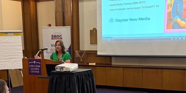 Michelle Cullison presenting on technology and digital marketing at a conference.