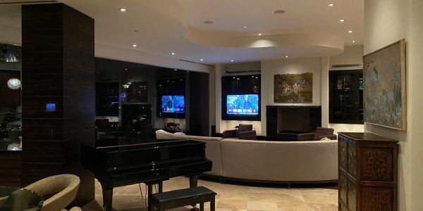 Elegant living room with grand piano and modern decor.