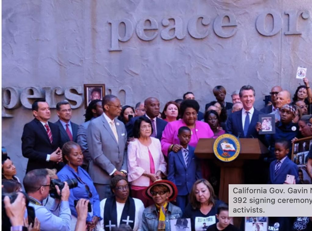 California Governor Gavin Newsom at a bill signing ceremony with activists.