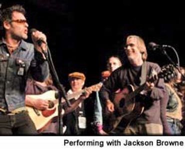 ilan Laks performing with Jackson Brown in front of 5,000 people in Wisconsin.