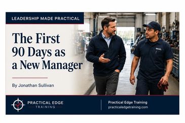 Two men discussing leadership training in a factory.