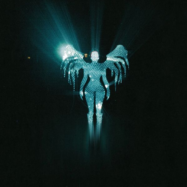 Silhouette of a figure with illuminated wings in a dark space.