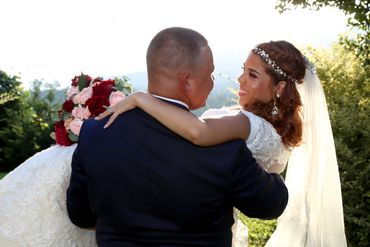 Groom carrying bride