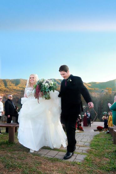 Post ceremony departure of bride and groom