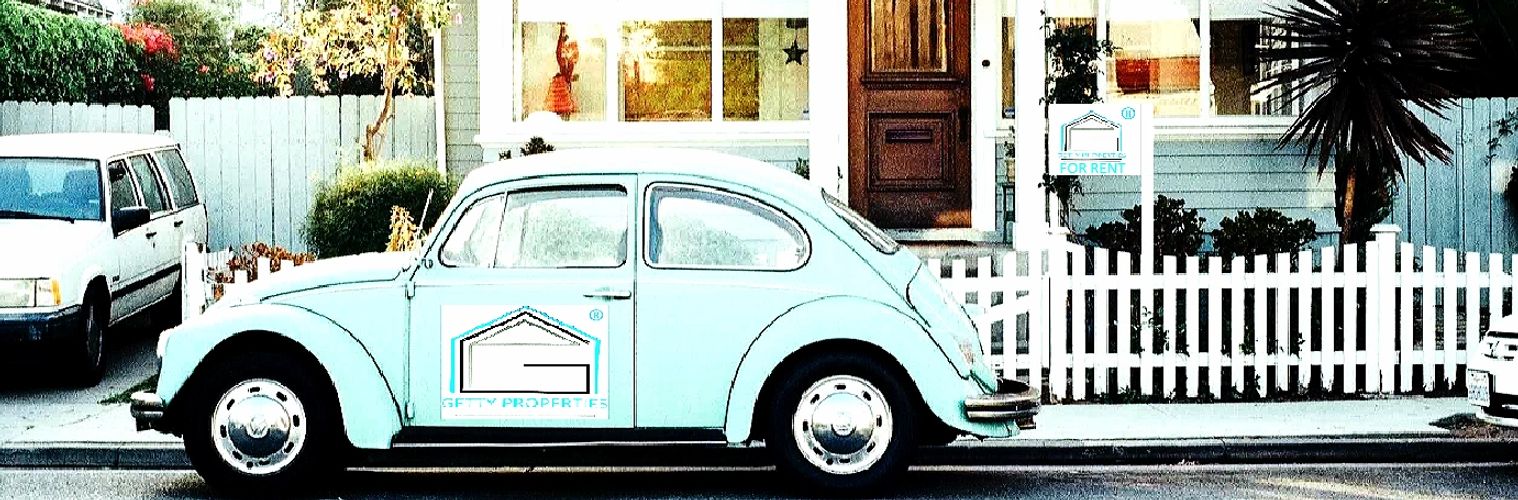 House with a sign for rent. Getty Properties logo on car outside