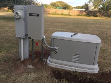 Outdoor electrical generator and meter box setup.