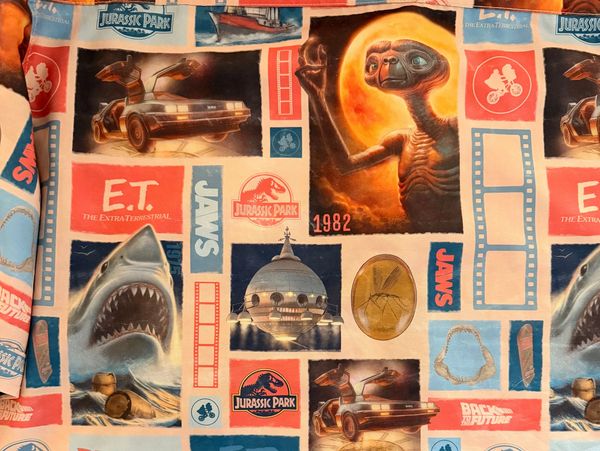 Fabric with classic 80s movie icons.