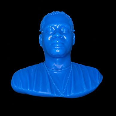 Blue bust sculpture of a man with a necklace on a black background.