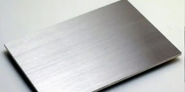 A flat rectangular metallic sheet.