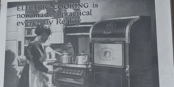 Old add from GE showing electric cooking becoming a practical reality