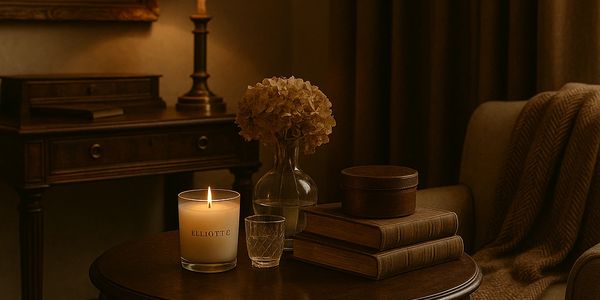 Candles on vintage side table with classic books 