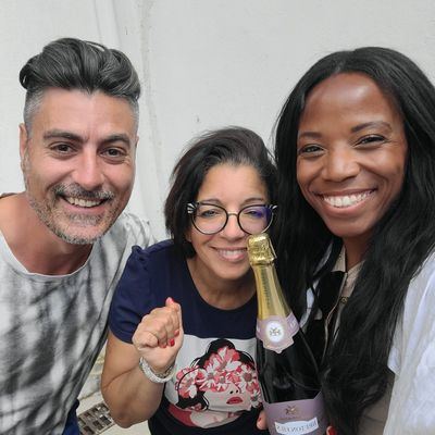 Holding champagne with grower and smiling