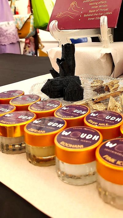 a row of WOUDH creme perfumes
