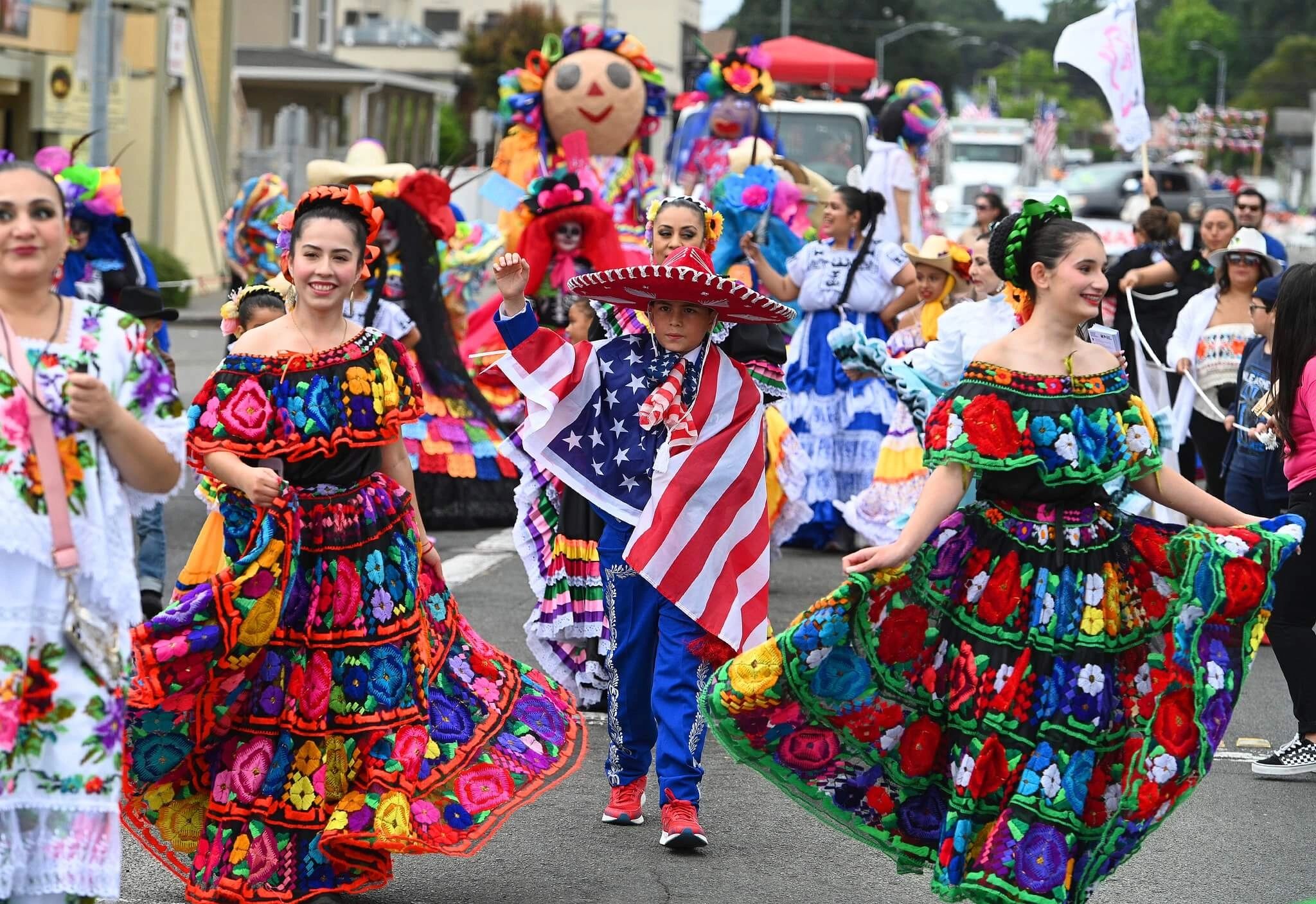 Baile folklórico dancers performing in Vallejo's July 4th parade.
