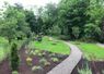 pea gravel pathways with a steel edge is always a classic look. It complements the horse statues indeed